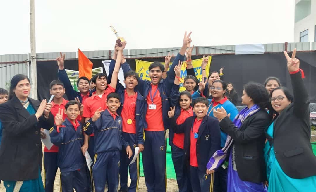 The Aryan International School students celebrating a sports achievement