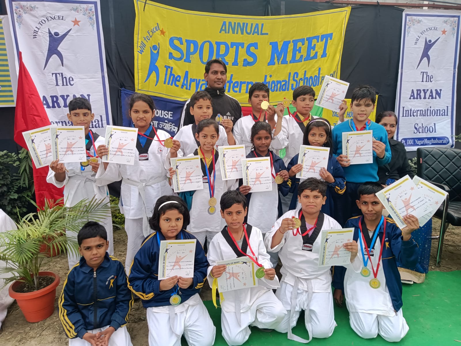 Students with awards at sports meet